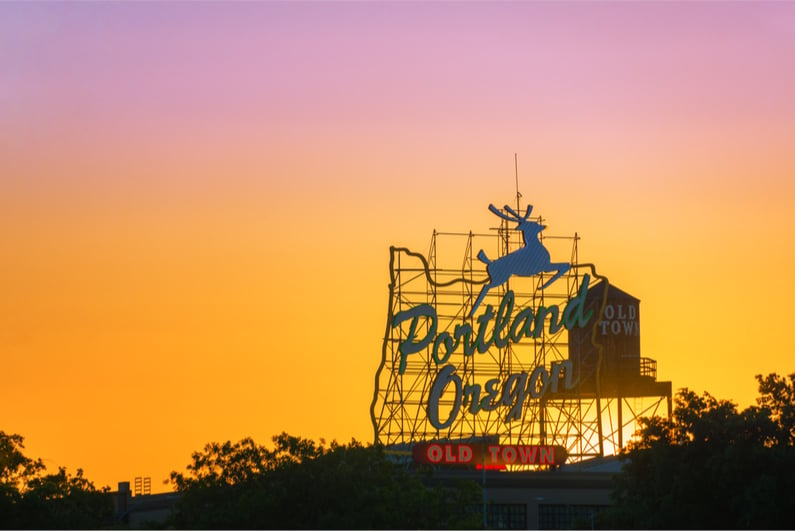 Sunset over the iconic Portland, Oregon Old Town sign