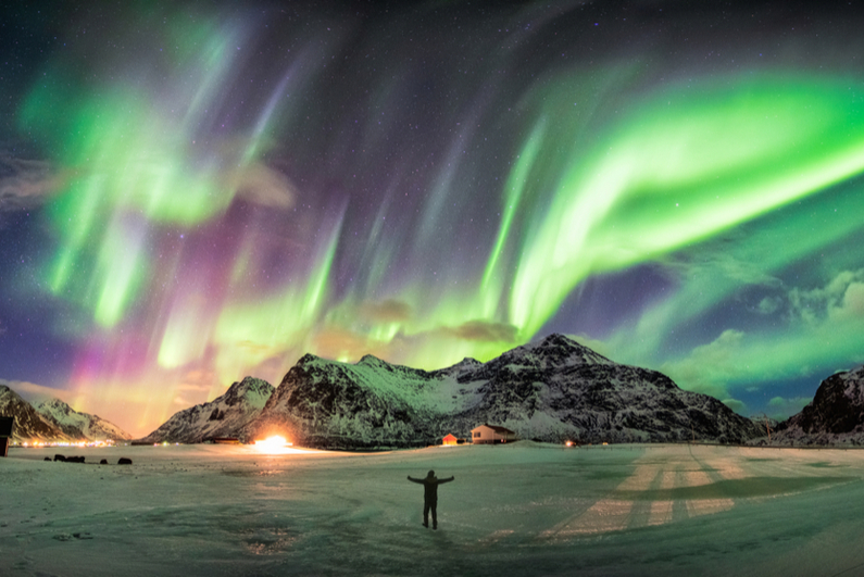 Aurora borealis (Northern Lights) over mountains in Norway