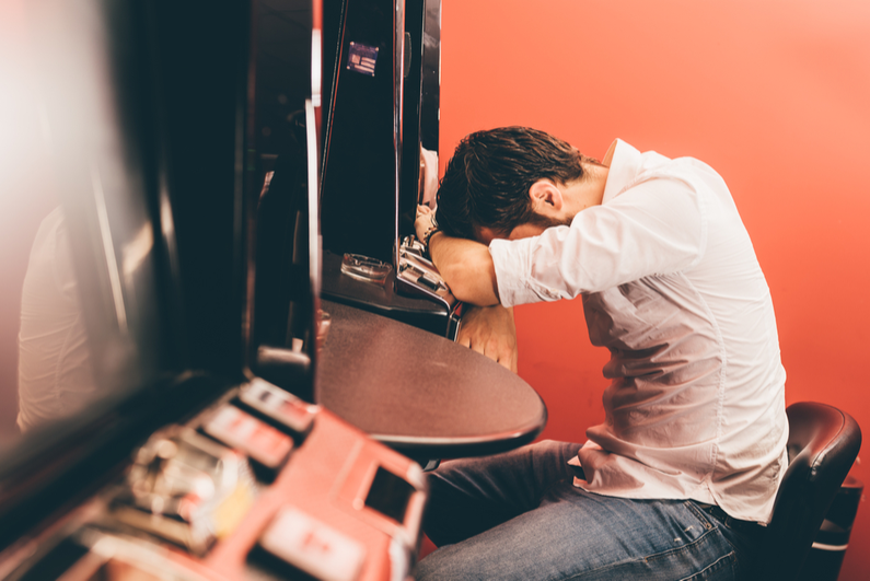 Man dejected over losing on slot machine