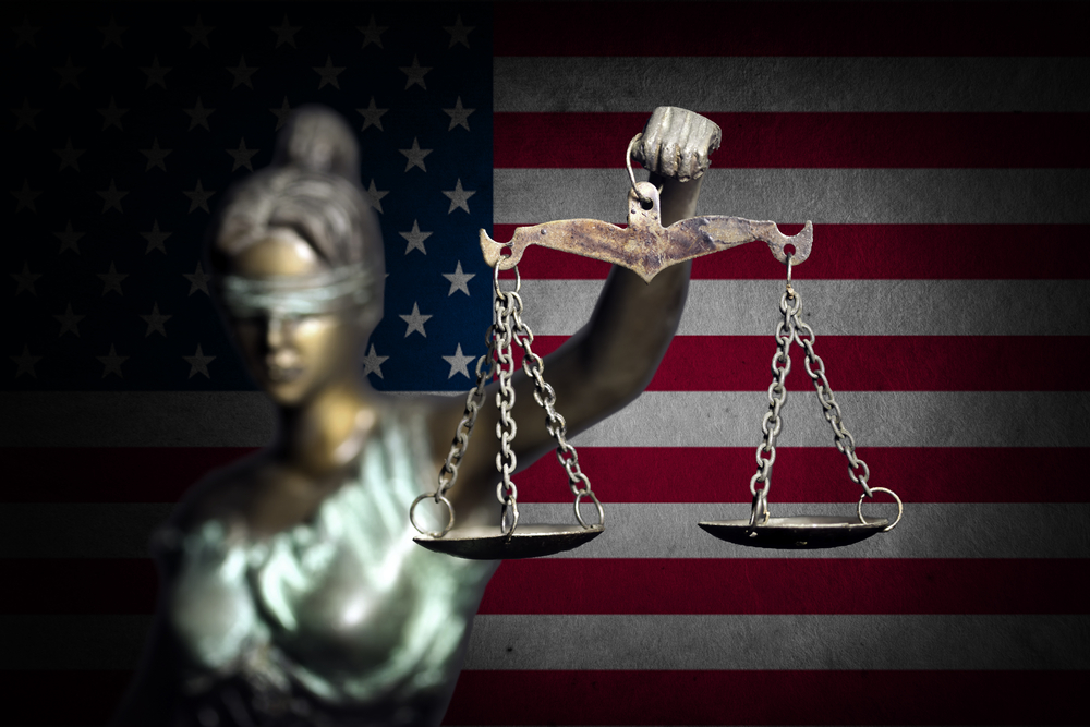 Lady Justice against US flag background