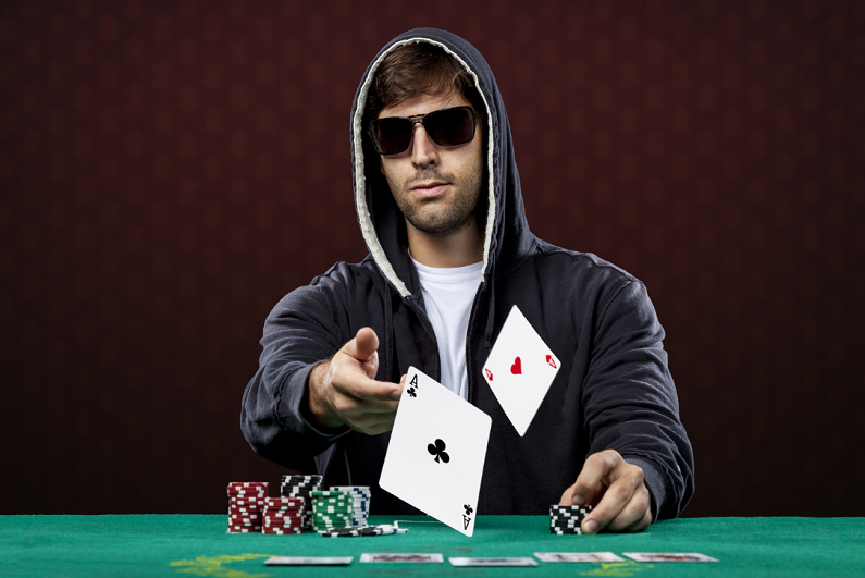 poker player, on a red background, throwing two ace cards