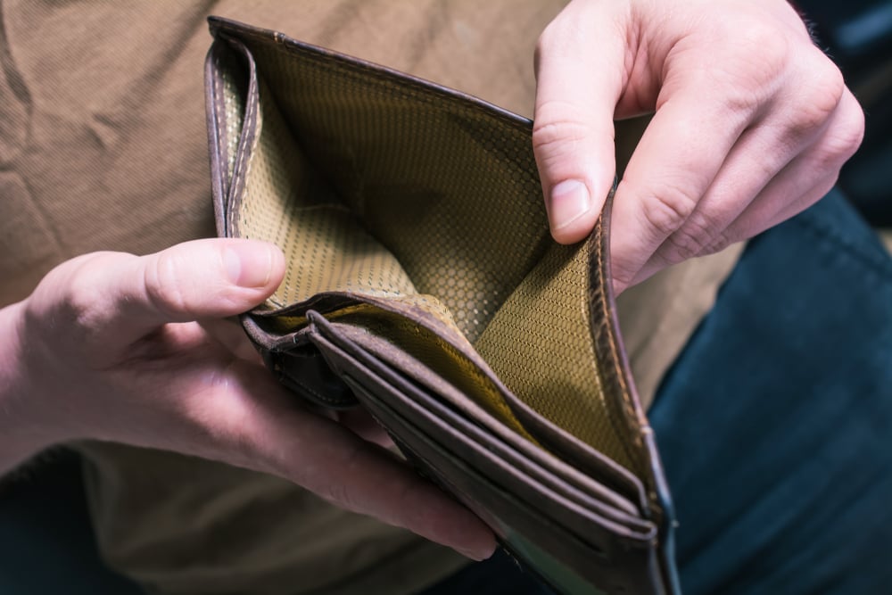 man holding empty wallet