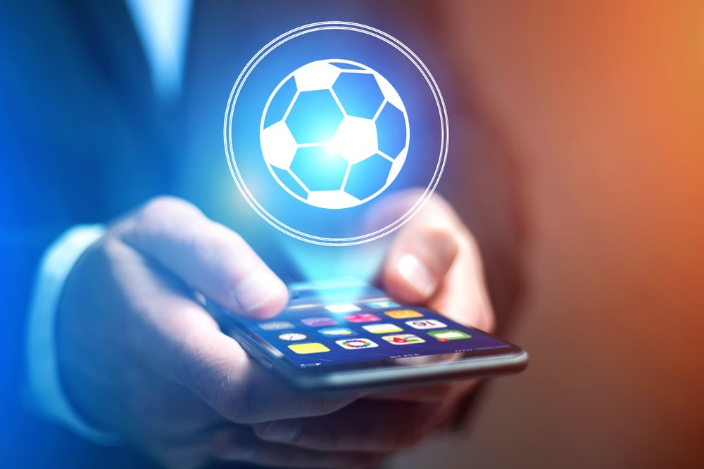 virtual soccer ball projection above smartphone