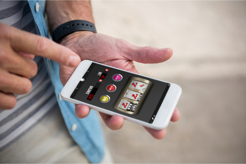 Man playing casino games on smartphone