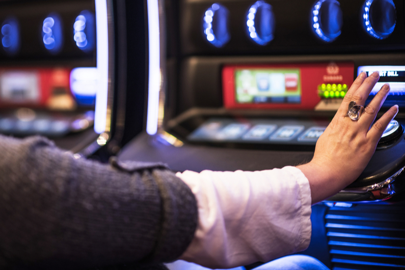 woman playing video poker