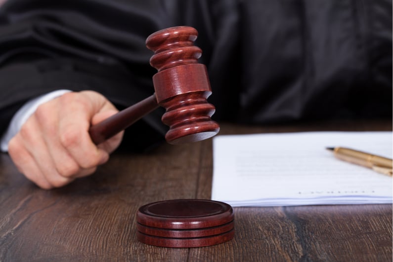 Closeup of judge banging a gavel