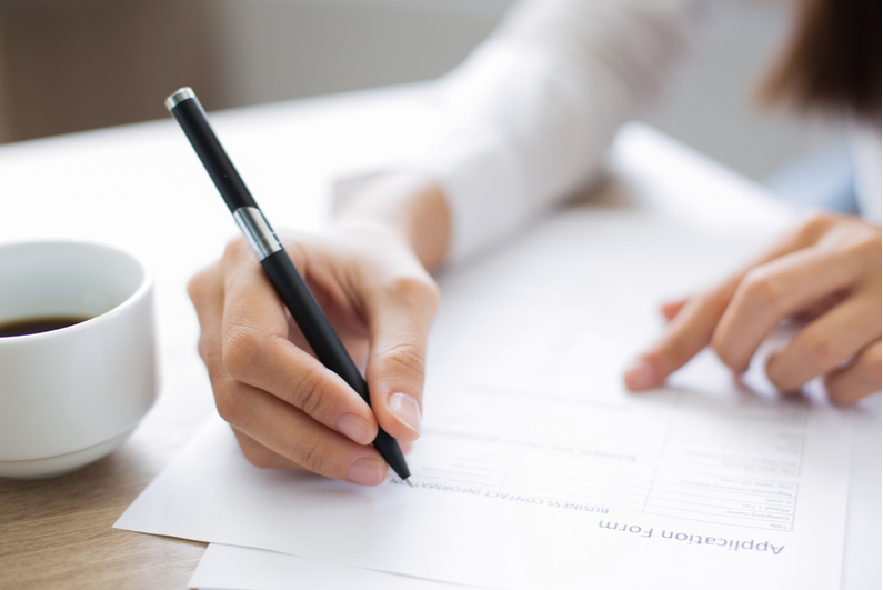 woman filling out an application form